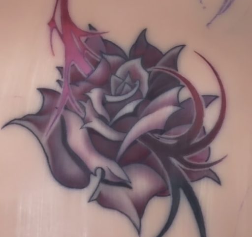 Purple rose with thorns tattoo